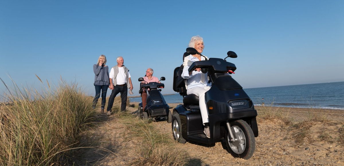 A woman using a Breeze S3 on the coast by the sea