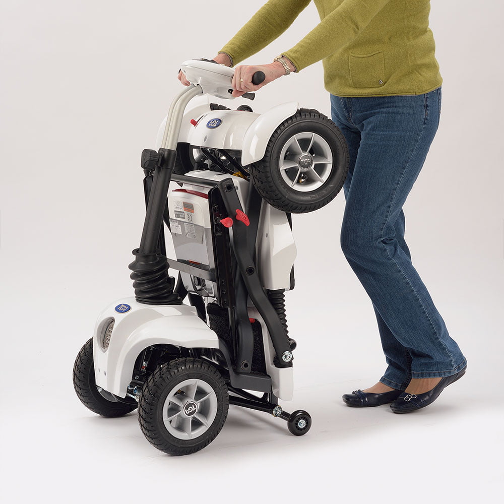 A person folding the Maximo folding mobility scooter