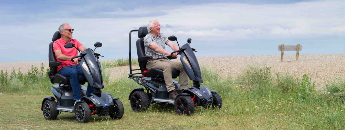 An older man on an all terrain mobility scooter from TGA